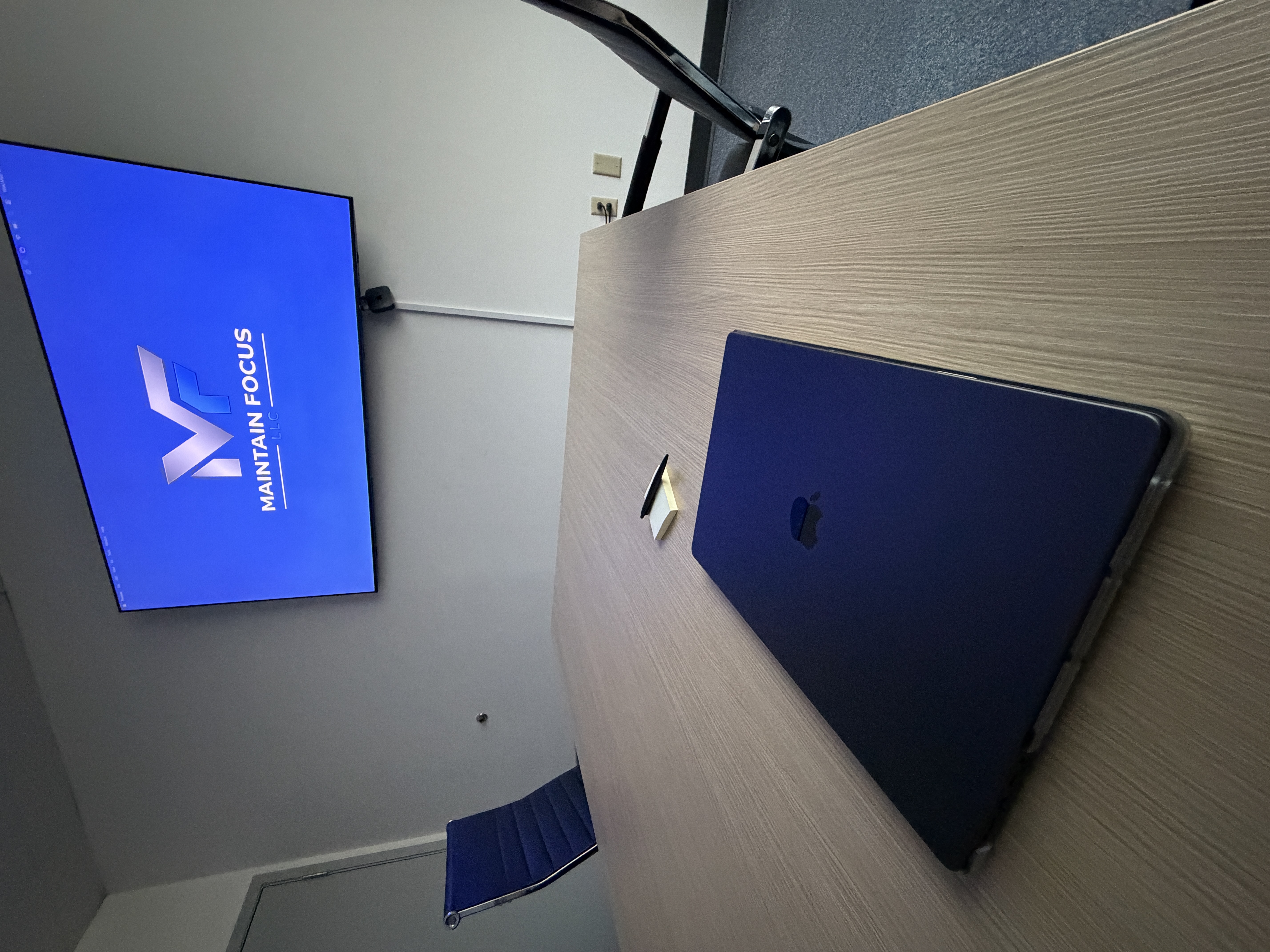 Business Programs workspace with laptop
